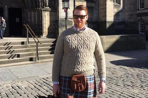One of our guides in a Kilt outside St Giles