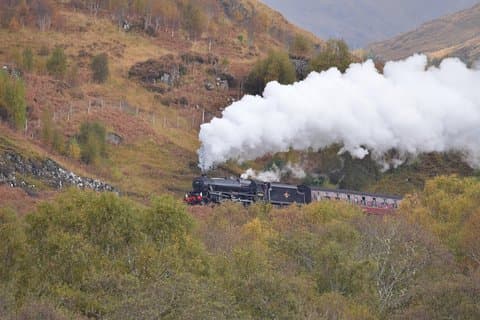 The "Jacobite Express" aka "Hogwarts Express" carrying wizards and muggles to Glenfinnan station!