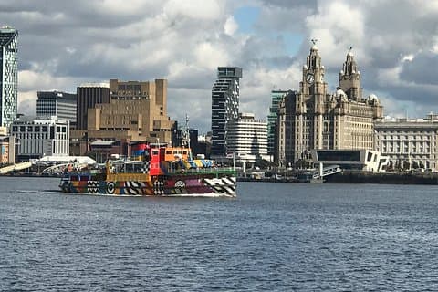 Take photos from the opposite side of the River Mersey