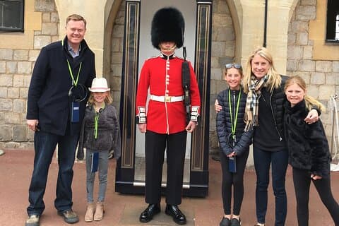 Trying not to make the soldier laugh.