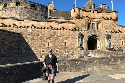 Our guide in a kilt, Josh in front of Edinburgh Castle
