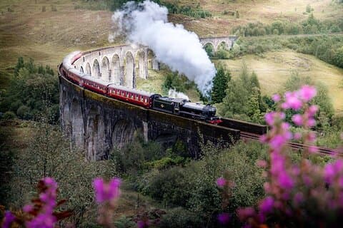 The Jacobite steam train crossing Glenfinnan viaduct