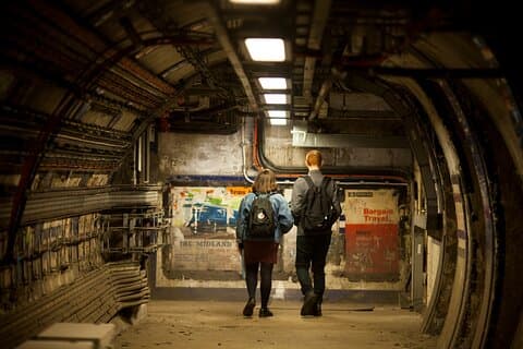 See vintage poster fragments in the time capsule corridors