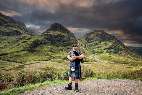 Scottish Piper in the Highlands