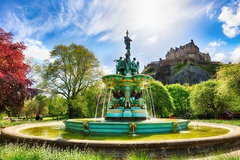 A photo of Princes St Garden Fountain with Edinburgh Castle in the background