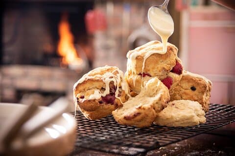 Traditional raspberry and white chocolate scones ready for afternoon tea.