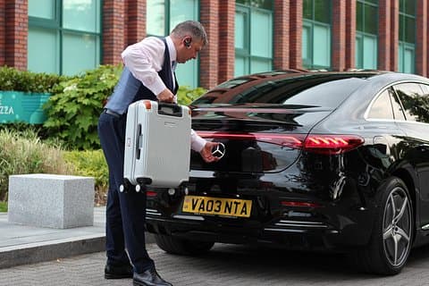 Preparing for a seamless airport transfer in the Mercedes-Benz EQE — VANTA Chauffeurs Chester.