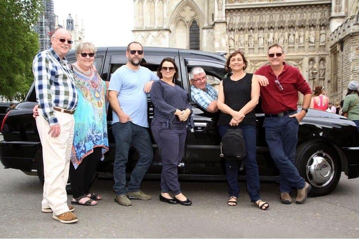 Guide Mick McTernan with his travellers at Westminster Abbey.