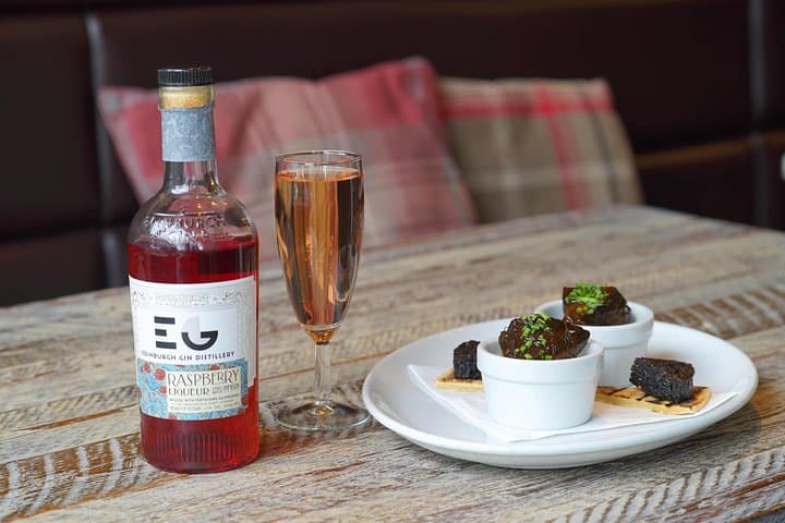 Edinburgh Raspberry Gin with Prosecco accompanying Braised Ox Cheek and mash with Stornoway Black pudding on a potato Scone,