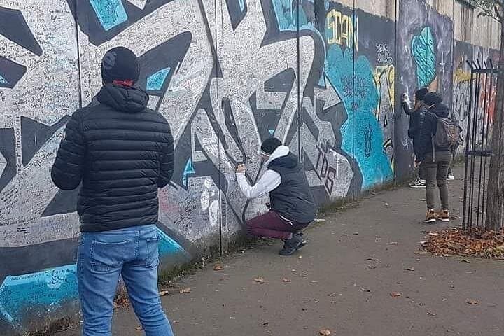 Sign Your Name and a Message of Peace and Hope on the Peace Wall