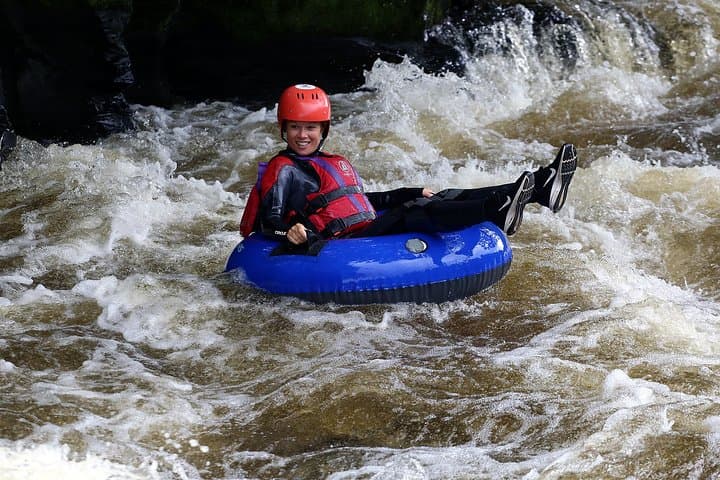 All smiles whilst tackling rapids in the Dee Valley, Llangollen.