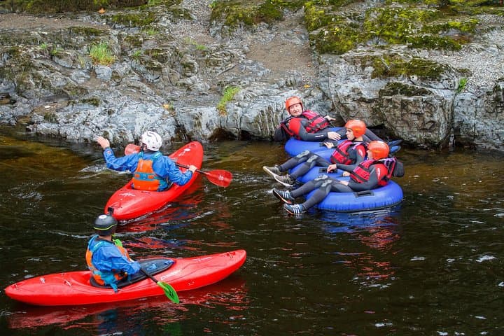 Our guides preparing their tubes before descending the rapids.