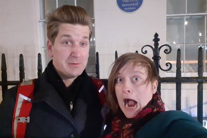 A scared couple after discovering the hidden stories of the London Haunted tour.