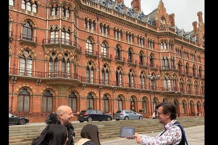 Dave showing the Woods family where Harry Potter and Ron Weasley flew over St Pancras