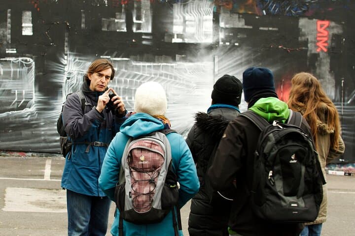 Discussing painting of train tracks by Dan Kitchener