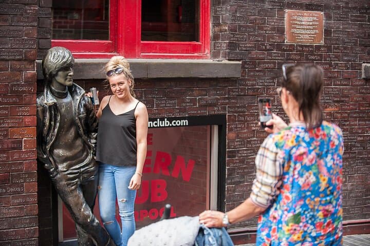 Posing with one of Liverpool's John Lennon statues outside The Cavern Wall of Fame, Mathew Street