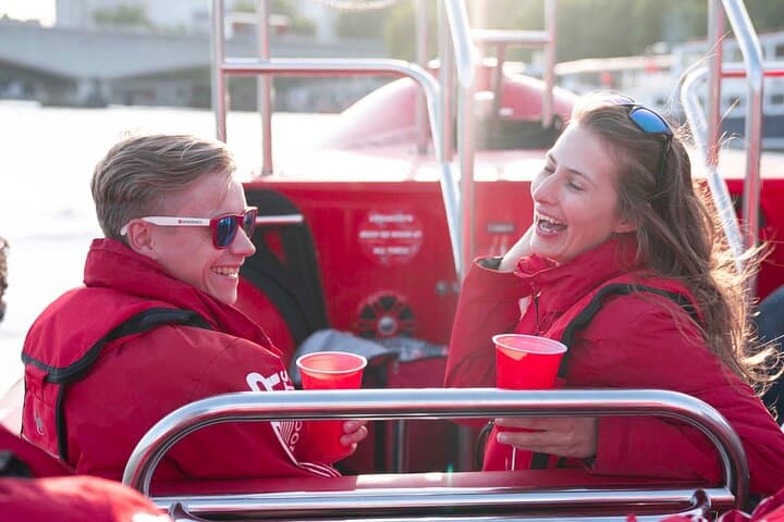 Enjoy a complimentary drink on board a Thames Rockets speedboat at sunset