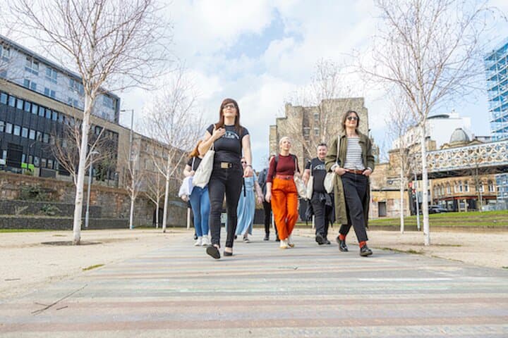 Guide Fiona leads the way on the Album Pathway at Barrowland Park