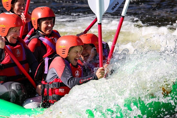 Wet, Wet, Wet for our happy customers on a sunny day white water rafting in Llangollen.