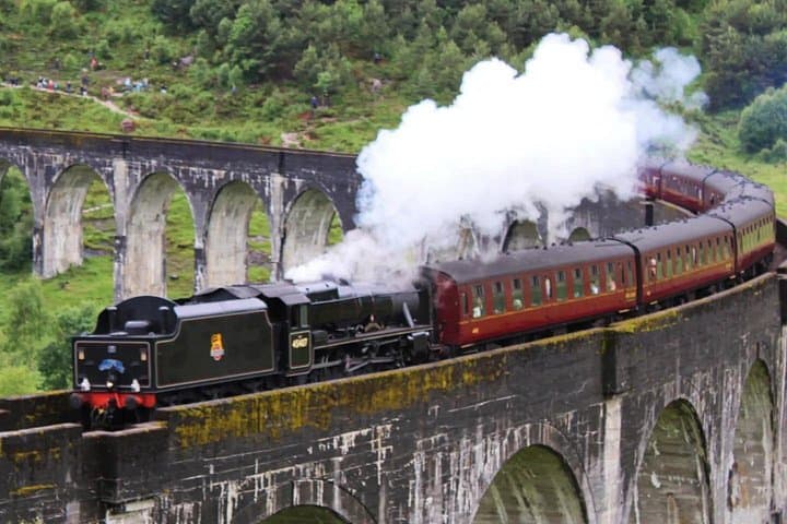 The Jacobite express Harry potter Train at glenfinnan viaduct
