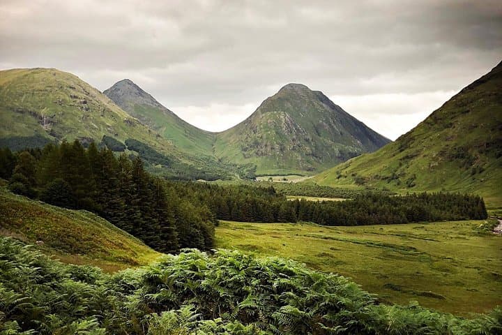 Winding Highland roads with breathtaking mountain and forest views.