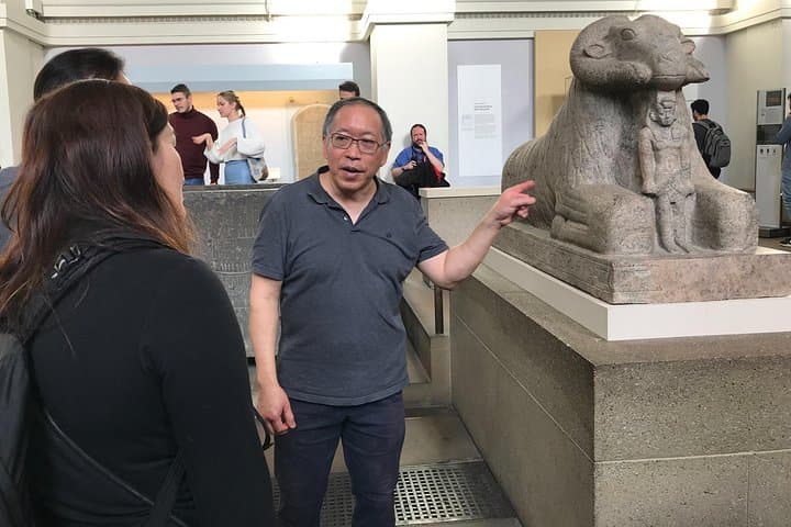 Pointing out King Tarhaqa, a pharaoh mentioned in the Bible. He is under the protection of the Egyptian god Amun, depicted as a ram.