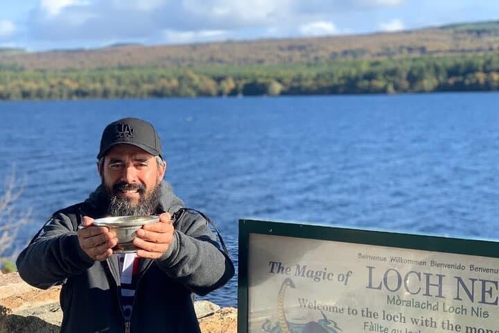 One of our guests drinking whisky from the quaich at Loch Ness