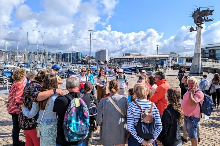Welcoming a large pre-booked group by the Mayflower Steps