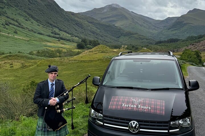 Tartan Tour Bus and Scottish Bag piper