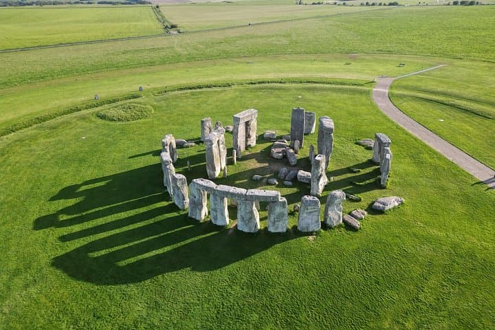 An aerial view of Stonehenge, the world-famous prehistoric monument, set in the rolling green countryside of Wiltshire.
