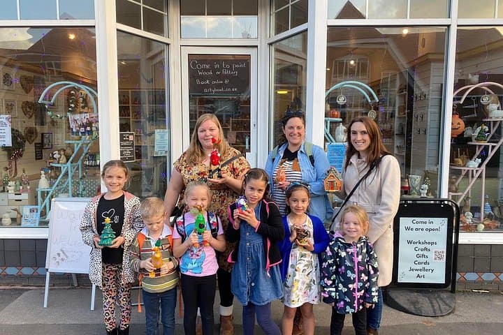 Families and friends showing their painted creations