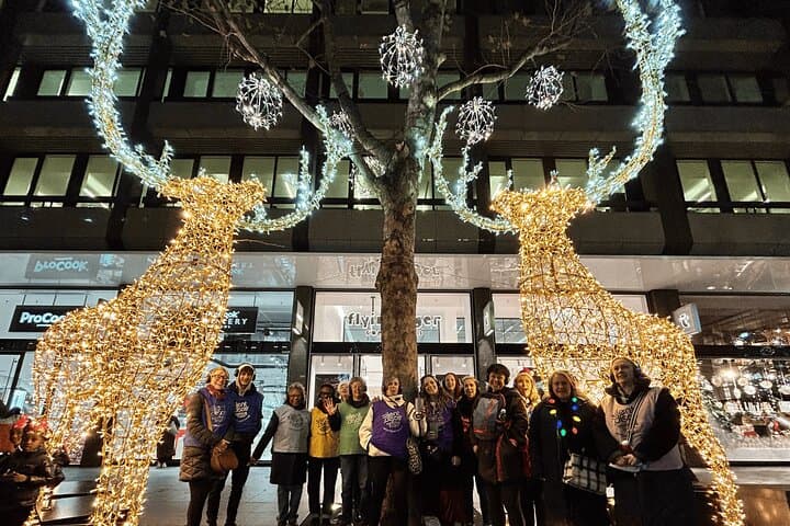 Group under giant reindeer