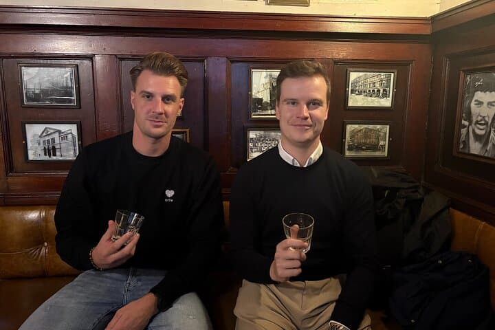 two Belgian cops relaxing with a whisky