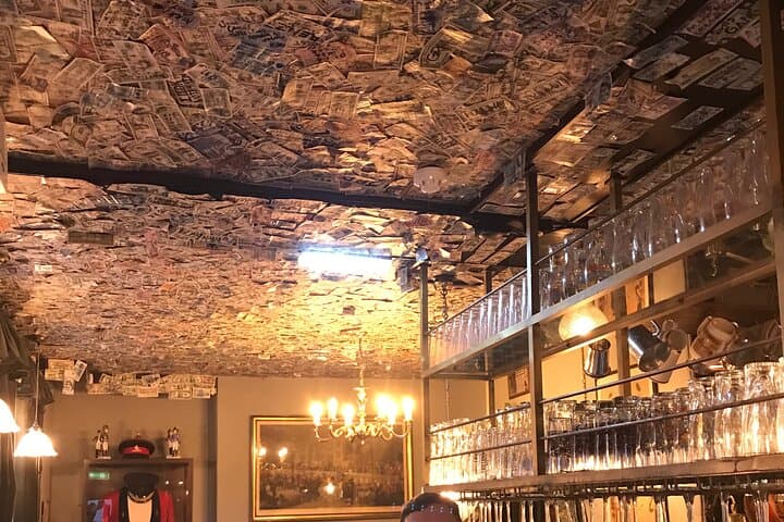 London ghost pub with dollars on the ceiling …. Interesting