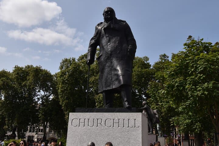 The famous statue of Sir Winston Churchill in Parliament Square. Stop here for the perfect photo, and hear how Sir Winston visited Parliament on the night of its bombing during the Second World War.