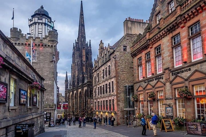Edinburgh’s historic Royal Mile is bustling with visitors, showcasing iconic medieval architecture and charming streetscapes.