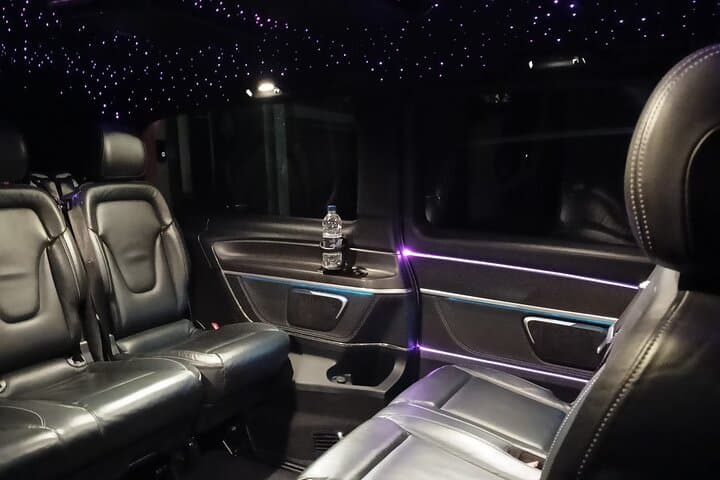 The interior of the vehicle which has three forward, and three rear facing seats.