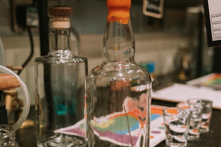 Distill a bottle of Gin on mini copper stills