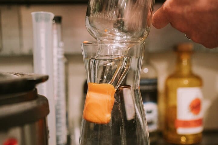 Distill a bottle of Gin on mini copper stills