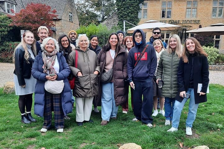 happy Go Cotswolds tour guests in Bourton-on-the-Water