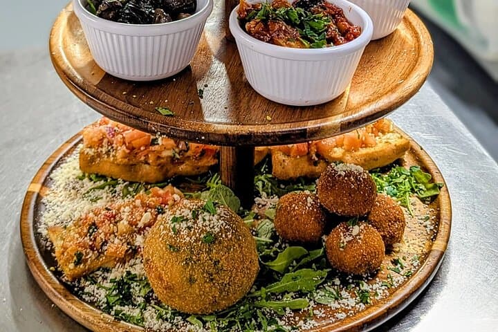 Example of Afternoon Tea Sicilian NQ. Food is Vegetarian. Arancinetti and Bruschetta