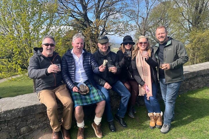 Bonnie Scotland Tours Donald enjoying an ice-cream while his guests try a dram of whisky at a Scottish castle!