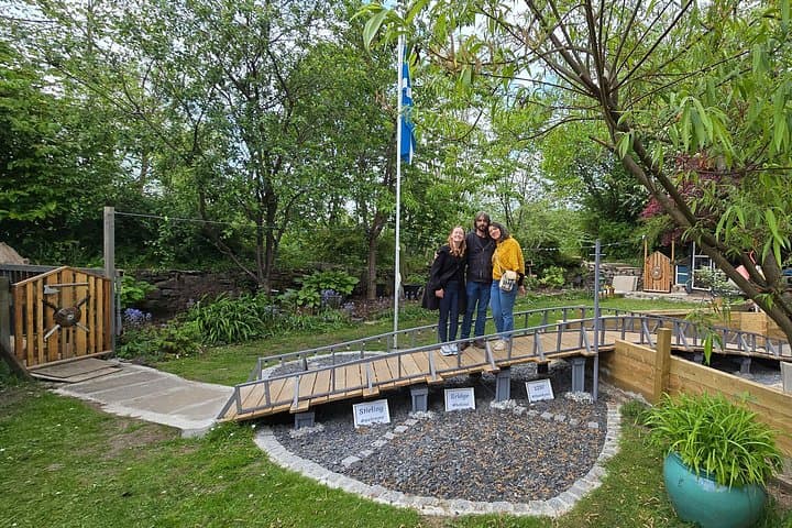 Casie, Danny & Becca in our Garden with the model of our wooden Bridge from the Battle of Stirling Bridge, 1297. May 2025.