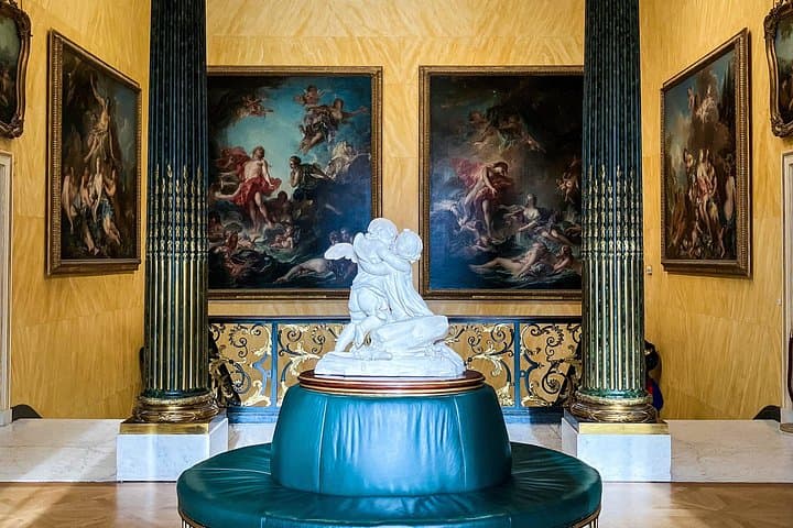 The landing, at the top of the grand staircase of the Wallace Collection, decorated with paintings by François Boucher