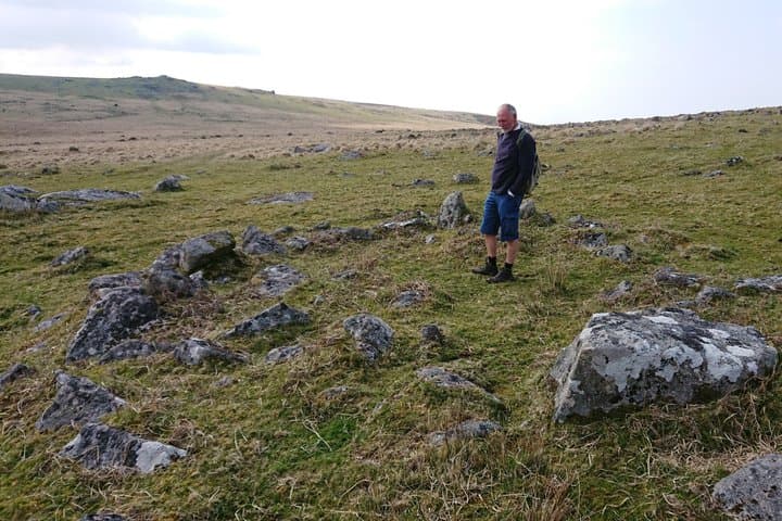 Contemplating life in a roundhouse on Stannon Moor.