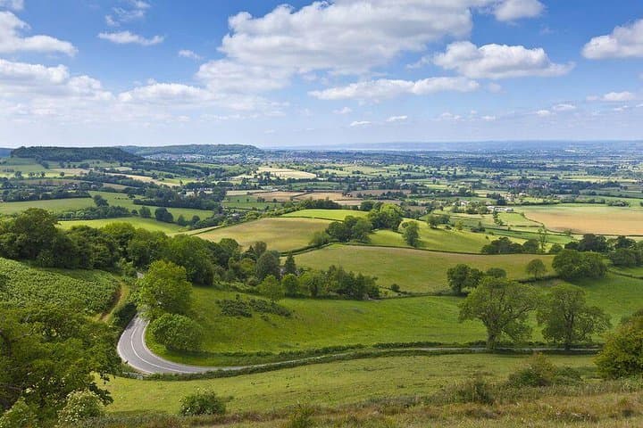 Drive through the Cotswolds Hills, a range of rolling hills