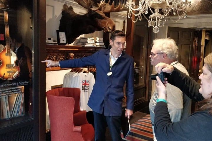 Guide Paul Williams with his guests in the Saville Row building,