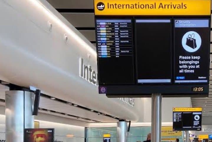 Driver Awaits Your Arrival In The Arrivals Hall With A Name Board