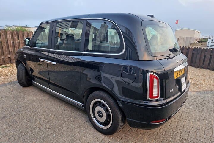 Your transport. A London Black taxi cab.